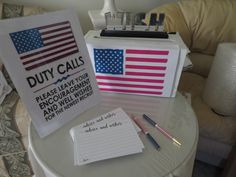 a desk with two signs and pens on it that say duty calls, please leave your enquirers and well wishes for the owner