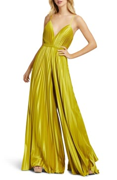 A fresh take on eveningwear, this wide-legged jumpsuit in pleated satin is exactly what you need for every party invite this season. 62 1/2" length Hidden back-zip closure Plunge neck Sleeveless Lined Asian Owned/Founded 100% polyester Spot clean Imported Women's Clothing Yellow Jumpsuit, Prom Dresses Yellow, Wedding Guest Attire, Guest Attire