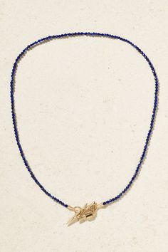 Marla Aaron's 'Itty Bitty' necklace is centered with a 'Boltlock' pendant shaped like a lightning bolt, inspired by Aladdin Sane himself and created to mark the Brooklyn Museum's 'David Bowie is' exhibition in 2018. Handmade from 14-karat gold, it's strung with vibrant lapis lazuli beads and looks great layered. Marla Aaron, Aladdin Sane, Lapis Lazuli Necklace, Lapis Lazuli Beads, Blue Necklace, Itty Bitty, Lightning Bolt, Rose Gold Necklace, Fine Jewellery Necklace