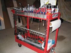 a red cart filled with lots of tools