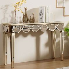 a console table with decorative items on it