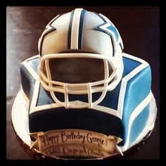 a football helmet cake on top of a table