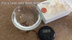 a dirty bowl with water next to a timer