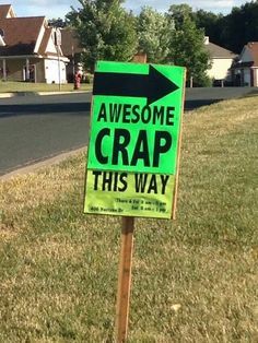 a green sign that says awesome crap this way