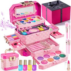 an assortment of cosmetics and makeup in a pink case