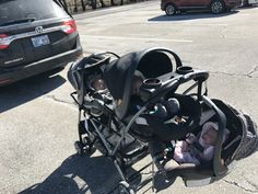 a baby in a stroller on the street