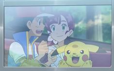 two people sitting next to each other in front of a tv with pokemon on it