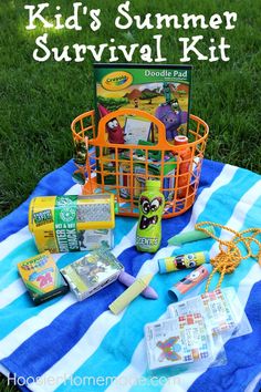 kids'summer survival kit on a blanket