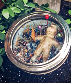 a glass ornament with an image of a baby doll in the middle of it