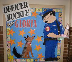 a bulletin board with a police officer and a dog on it