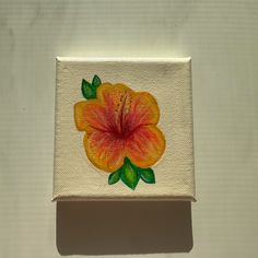 an orange flower painted on white paper with green leaves