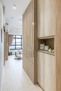 an empty room with wood paneling on the walls and shelves in front of it