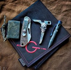 some tools are laying on top of a cloth