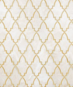 a white and gold wallpaper with an intricate design