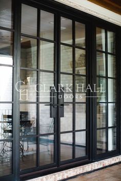 an open glass door on the outside of a building