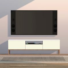 a flat screen tv sitting on top of a white entertainment center