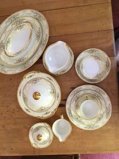 an assortment of china on a wooden table