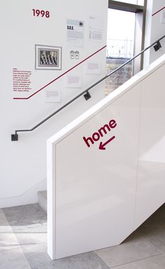 an escalator with the word home written on it