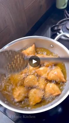 a video demonstrating how to cook chicken in a pot on the stove top with a spatula