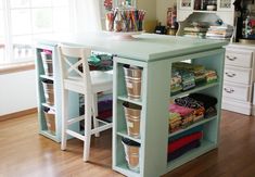 an organized craft room with lots of storage