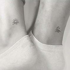 two small sun and moon tattoos on the wrist