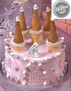 a birthday cake with three cones on top