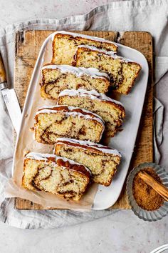 slices of cinnamon swirl bread on a cutting board with icing drizzled over them