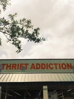 there is a sign that says thrift addition on the front of this storefront