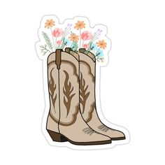 a pair of cowboy boots with flowers sticking out of the boot's toe sticker