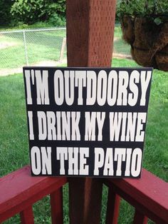 a sign that says i'm outdoorsy, i drink my wine on the patio