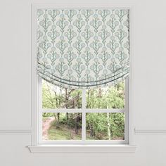 a window with a blue and white roman blind