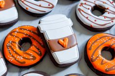 there are many decorated donuts on the table