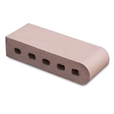 a concrete block with four holes in the middle and one hole on the outside side