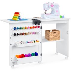 a sewing table with an ironing board and various craft supplies on it's shelves