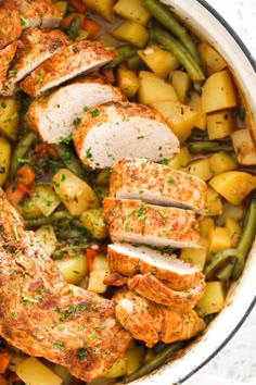 chicken, potatoes and green beans in a skillet