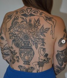 the back of a woman with tattoos on her body