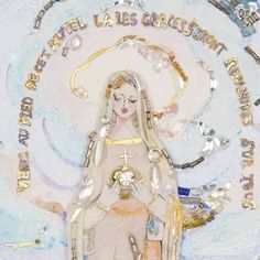 an image of the virgin mary in gold and white with words around her, on a blue background