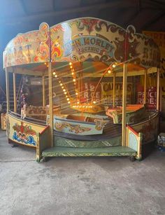 an old carnival ride with lights on it