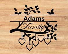 personalized family name cutting board with hearts and tree branches on the bottom, engraved in black ink