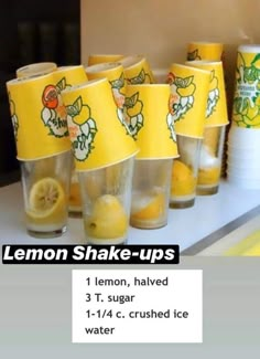 lemon shake - ups are lined up on a counter with cups and lemons in them