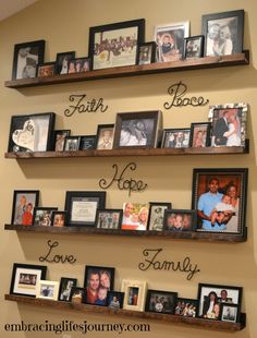 some shelves with pictures and family photos on them