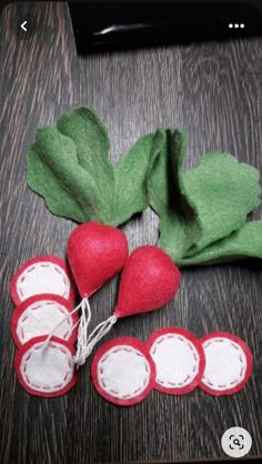 some red and green vegetables on a wooden table