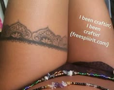 a woman's legs with tattoos and bracelets on them