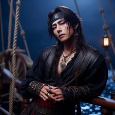 a man dressed in pirate garb standing next to a boat at night with his arms crossed