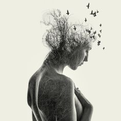 a woman with birds flying over her head