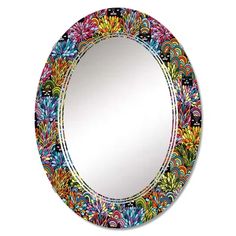 a round mirror with colorful designs on the front and sides, hanging from a wall