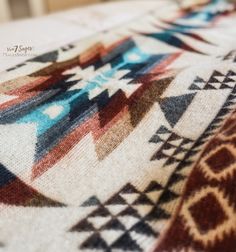 a close up view of a blanket with an interesting design on the bottom and sides