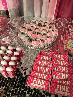 pink cupcakes and other treats on a table