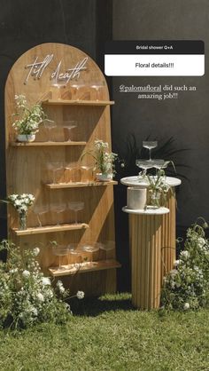 an image of a wooden stand with flowers on it and the words bridal shower are displayed