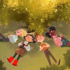 three people laying on the ground in front of a tree with yellow leaves and green grass